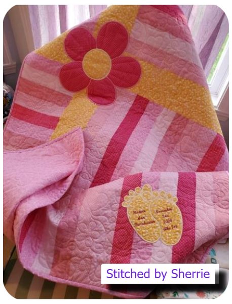 Large Flower Applique Quilt with baby feet by Sherrie a